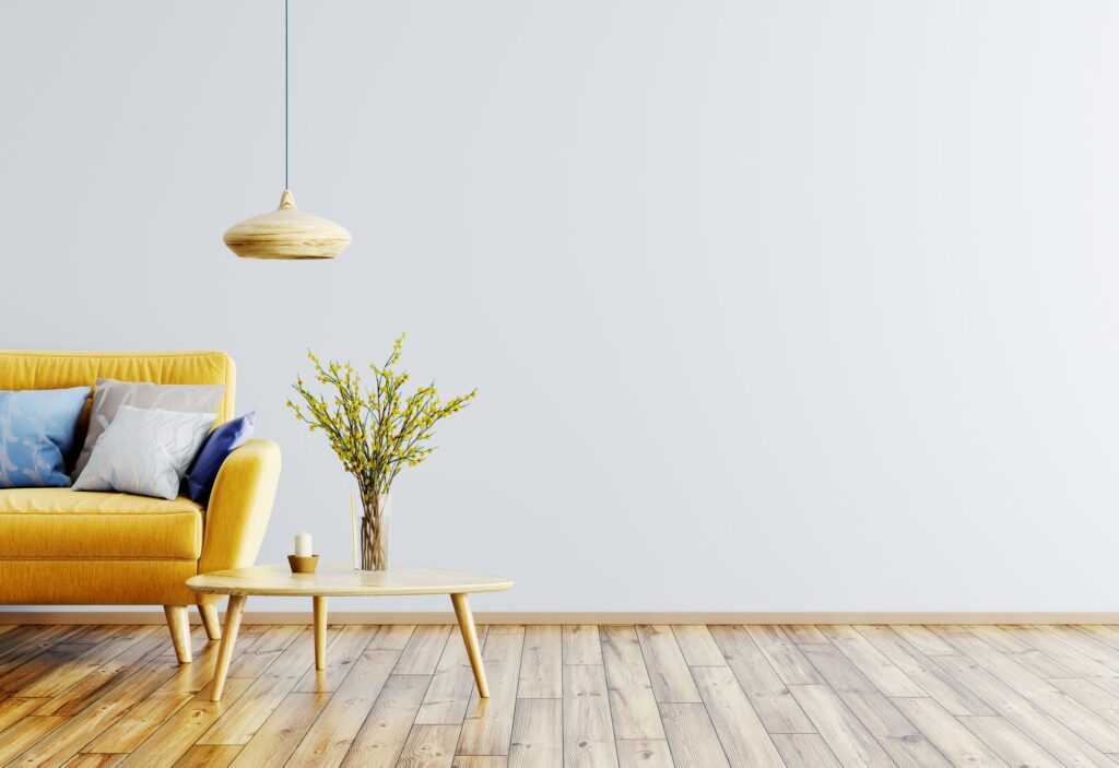 hardwood flooring with yellow couch in room