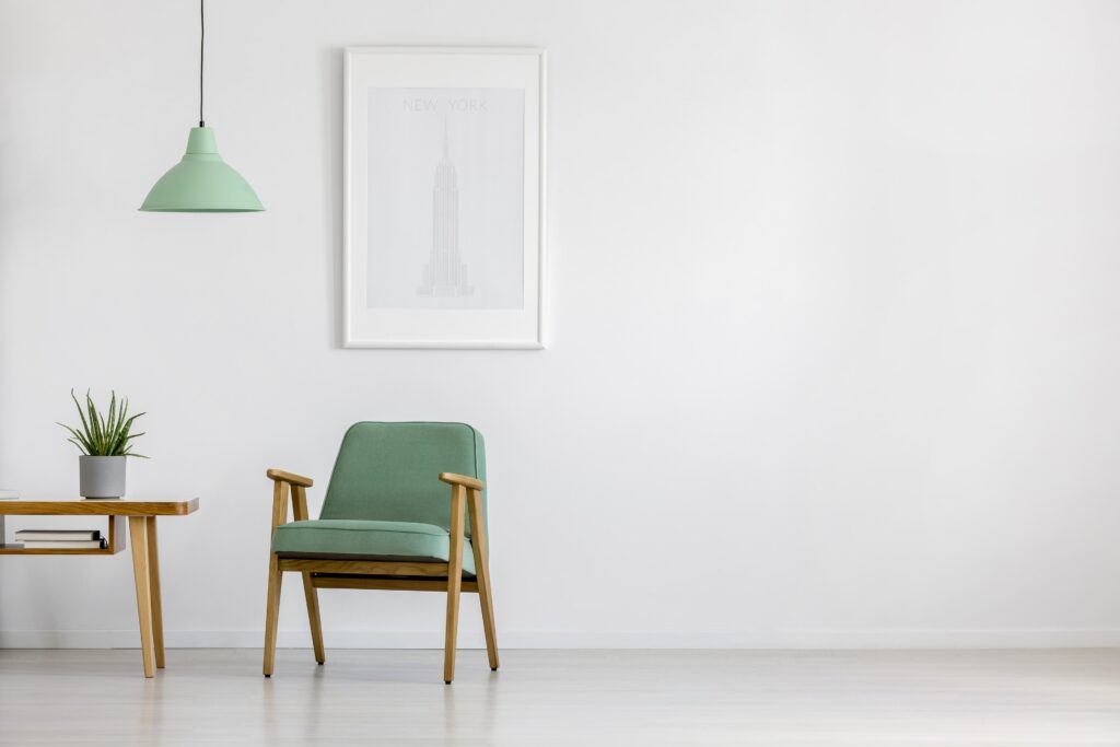green chair against white wall
