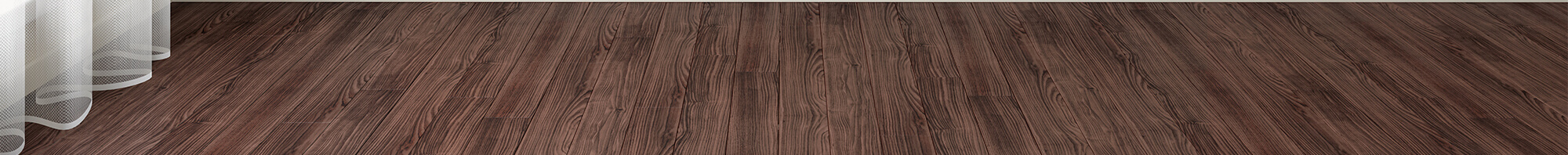 Up-close photo of wood flooring with curtain hanging on floors