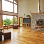 home with wood floors and stone fireplace