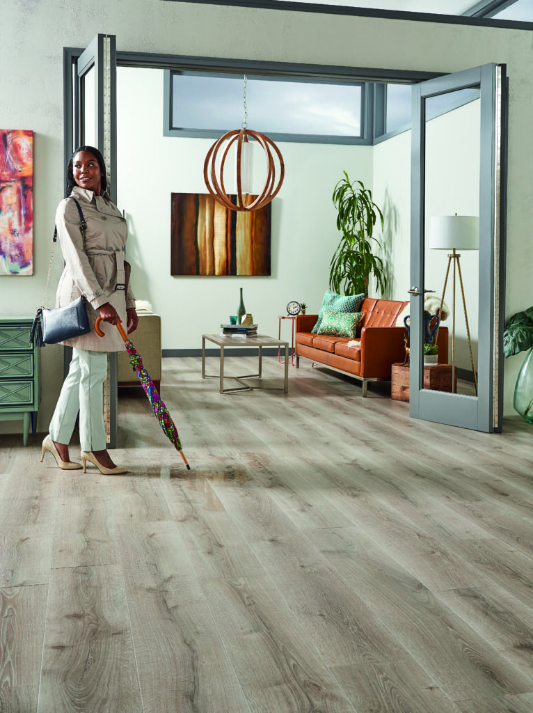 woman walking on waterproof laminate flooring