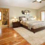hardwood floors in bedroom with rug