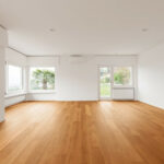 empty room in home with hardwood flooring
