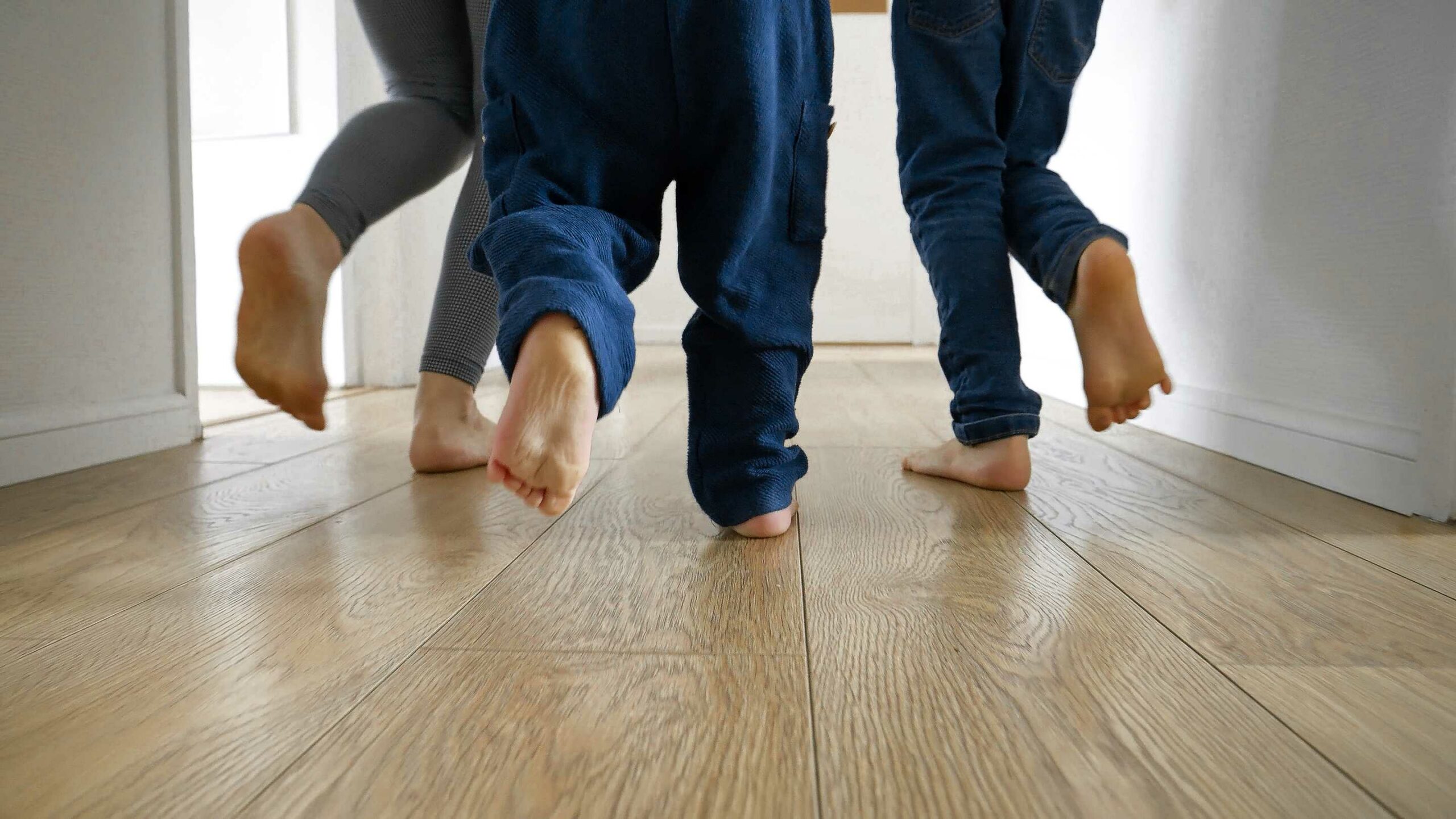 family running with laminate flooring
