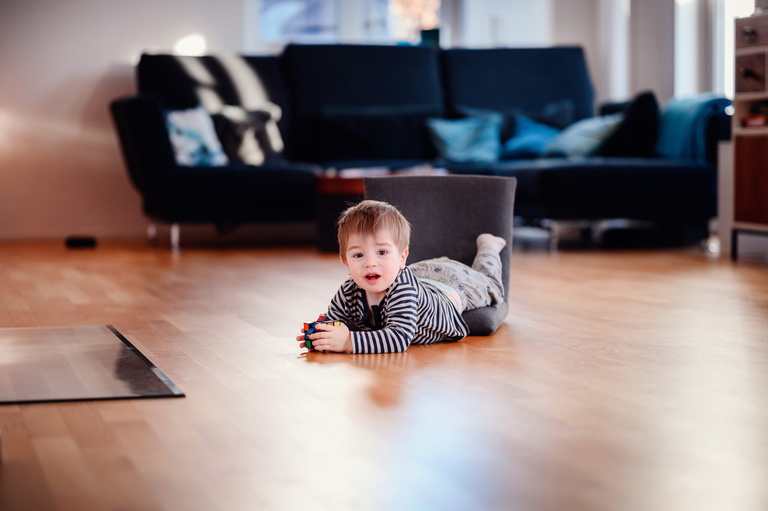 little-happy-toddler-boy-playing-with-cube-and-flo-2023-11-27-05-21-40-utc