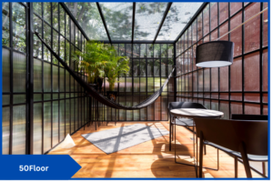 Modern sunroom with a hammock and some plants