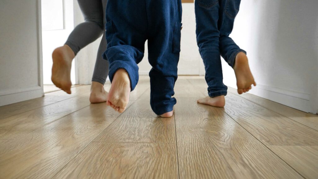 kids running on basement with lvt flooring